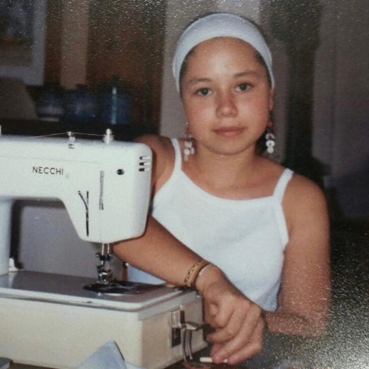 Little Nati Botero at her sewing machine.